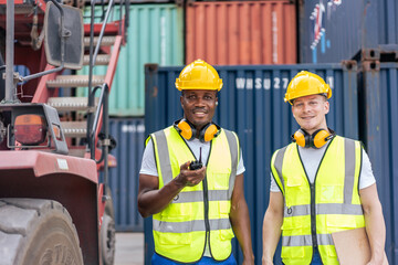 Portrait of Caucasian worker and African man work in container port.