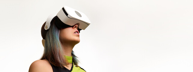 Woman is using virtual reality headset. Concept of virtual, augmented and extended reality and metaverse.