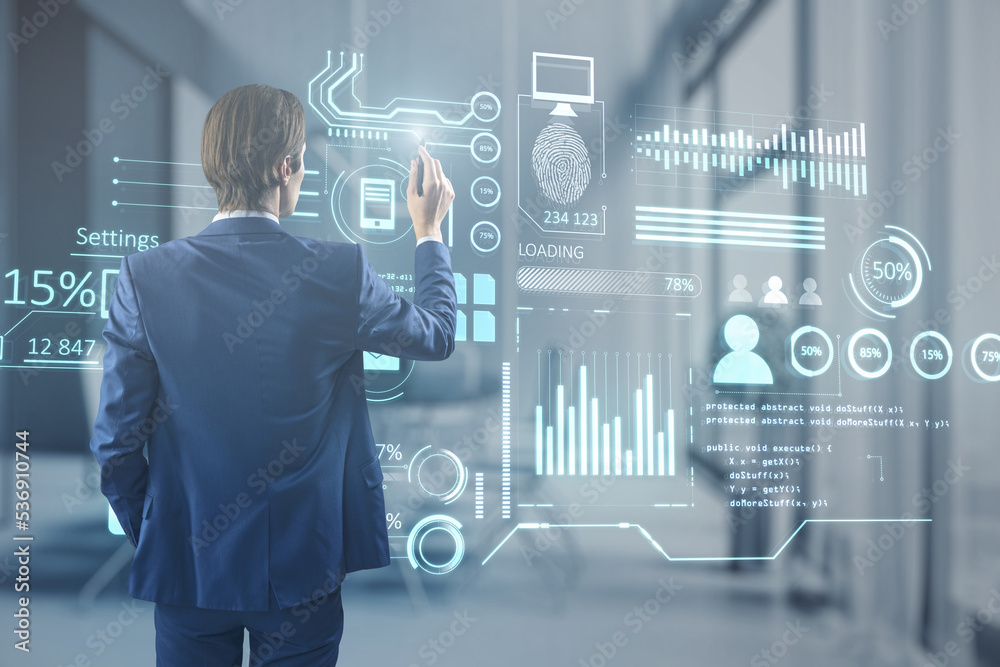 Poster businessman using creative glowing business chart interface hologram on blurry office interior backg