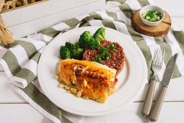 Cod fillet with brown rice and steamed broccoli. A beautiful display on the plate.
