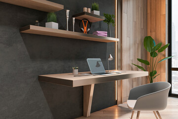 Perspective view on stylish work place table with modern laptop in sunlit cabinet with dark and wooden wall and grey chair. 3D rendering