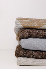 Fototapeta na wymiar A pile of knitwear for the winter