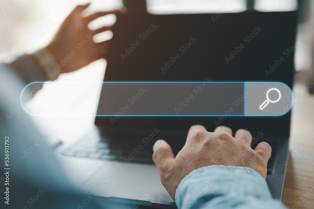 Fototapete Data Search Technology Search Engine Optimization. man's hands are using a computer notebook to Searching for information. Using Search Console with your website.