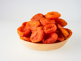 pile of dried ripe apricots on white background