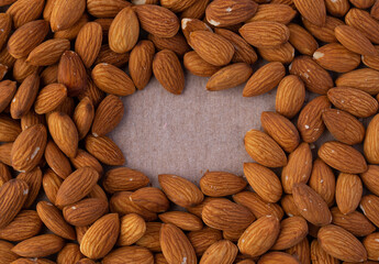 Background closeup of raw almond with space in the middle for your text or logo