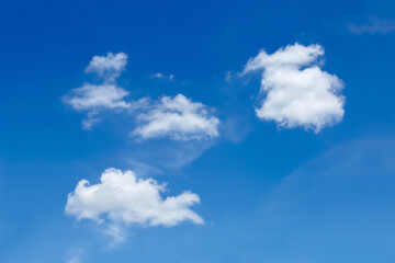 Naklejka na ściany i meble Natural beautiful blue sky and light white puffy clouds abstract natural background.