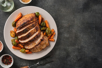 Roasted pork Loin with carrot and broccoli. Grilled sliced Pork Meat