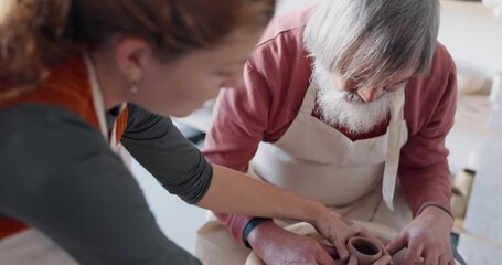 Hands, pottery and clay with a man student learning from a female potter in the studio or ceramic workshop. Art, creative and sculpting with a woman teacher with a male artisan during a lesson