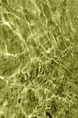 Defocus blurred transparent blue colored clear calm water surface texture with splash, bubble. Shining blue water ripple background. Surface of water in swimming pool. Blue bubble water shining.