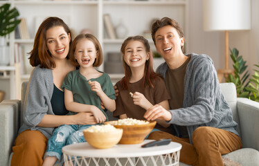 Mother, father and daughters spending time together.