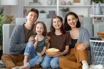 Mother, father and daughters spending time together.