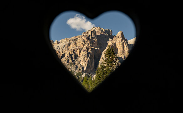 Dolomites seen through heart shape hole