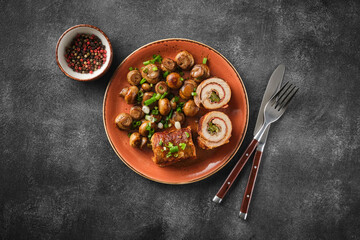 Pork roulade with pickles and bacon, served with fried mushrooms and green onions