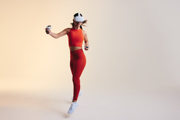 Fototapeta na wymiar Young woman doing a running workout in virtual reality