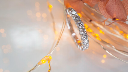 Close up of diamond ring with blurry bokeh background. Love, valentine, relationship and wedding concept. Soft and selective focus.