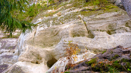 The large sandstone cliffs of Sietiniezis on the banks of the Gauja River in Latvia. tourist nature trail for hiking with wooden stairs. Gauja National Park in the vicinity of Valmiera, Autumn, 