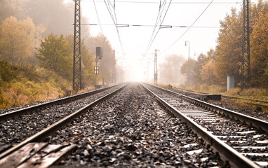 Railway tracks in country on the autumn. Train journey.