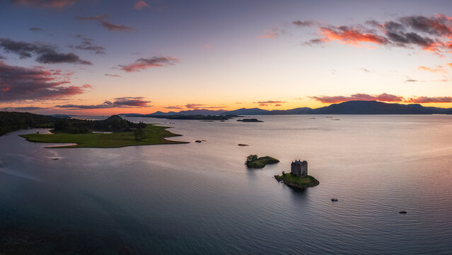 Aerial view of Castle Stalker on Loch Linnhe at sunset, Scotland
