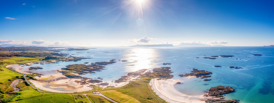 Aerial view of Traigh beaches with Isles of Eigg and Rum on sunny day, Scotland