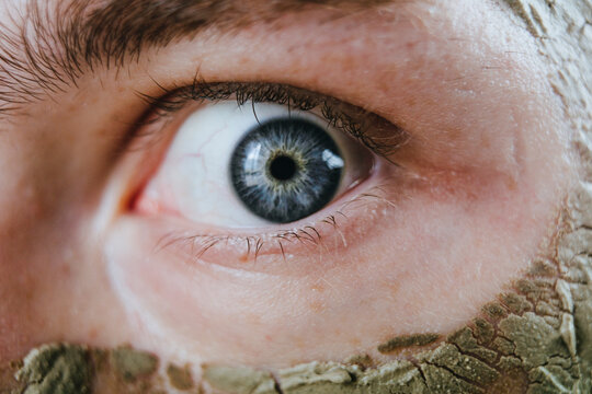 Close-up of human eye with facial mask