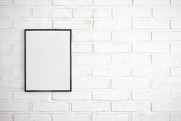 photo or picture frame over white brick wall background