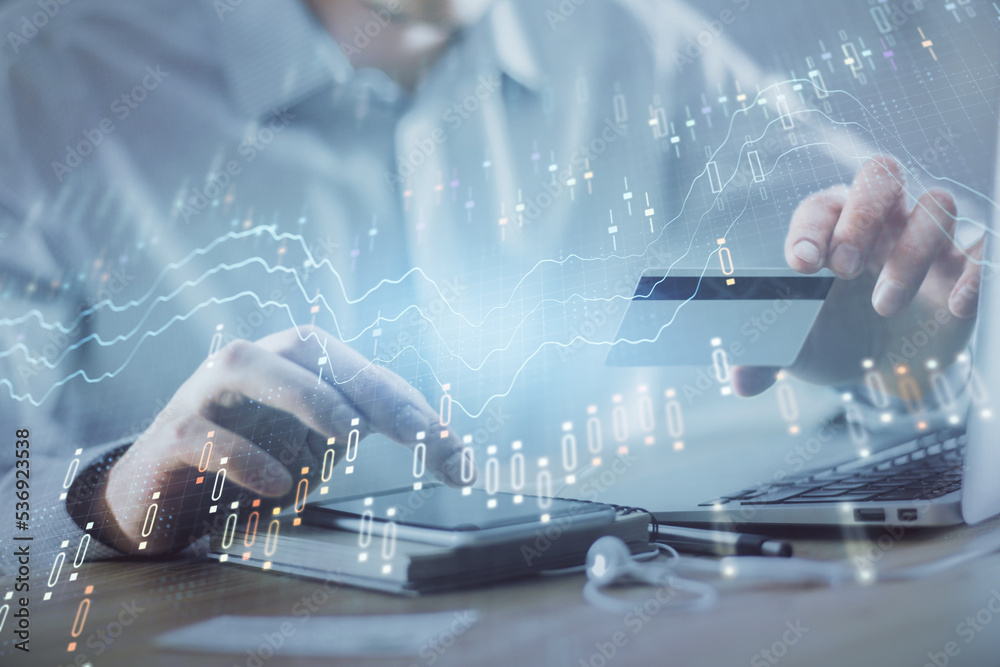 Poster double exposure of man hands holding a credit card and forex graph drawing. stock trading and digita