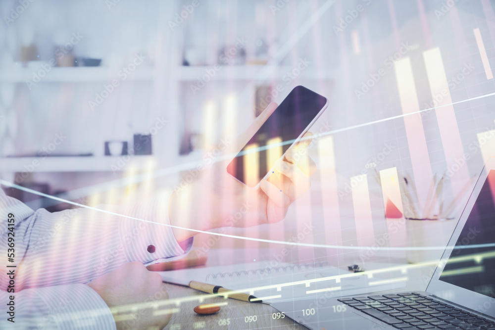 Poster double exposure of man's hands holding and using a digital device and forex graph drawing. financial