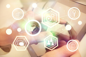 Double exposure of man's hands holding and using a phone and social network theme drawing.