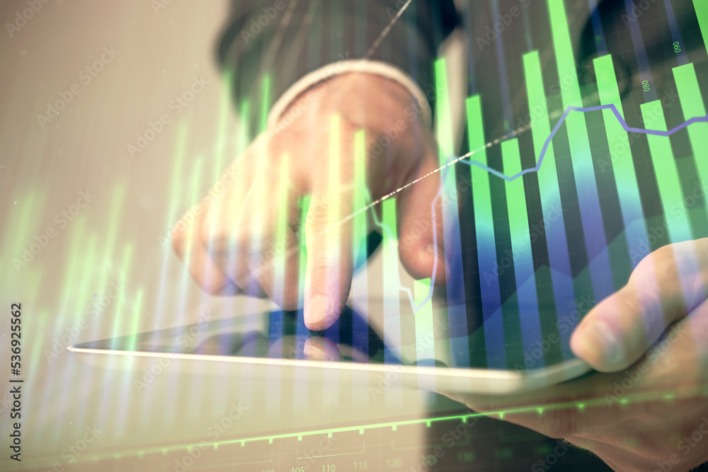 Poster multi exposure of man's hands holding and using a phone and financial chart drawing. market analysis