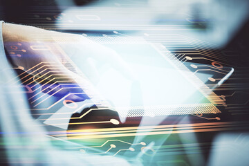 Multi exposure of man's hand holding and using a digital device and data theme drawing. Innovation...