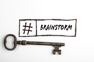 Brainstorm. Key and hashtag sign with text on white background
