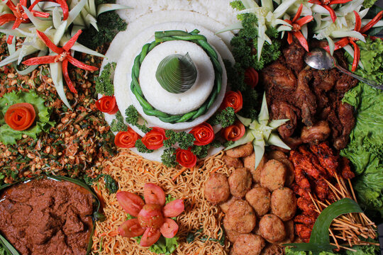 Indonesian style tumpeng rice with various side dishes