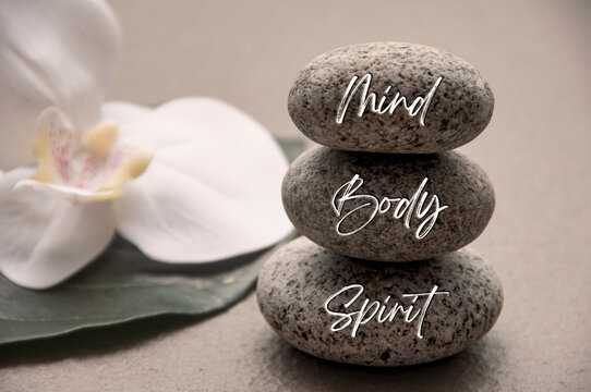 Mind, Body and Soul words engraved on zen stones with space for text. Health life concept.
