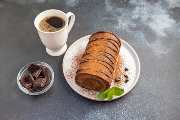 Home made chocolate roll cake filled with chocolate cream. 