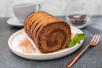 Home made chocolate roll cake filled with chocolate cream. 