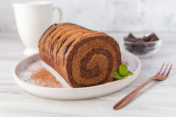 Home made chocolate roll cake filled with chocolate cream. 