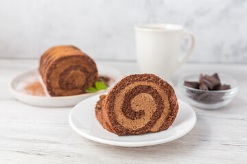 Home made chocolate roll cake filled with chocolate cream. 