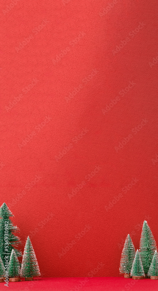 Aufkleber Christmas pine tree group on red vertical background.mockup banner for display content design