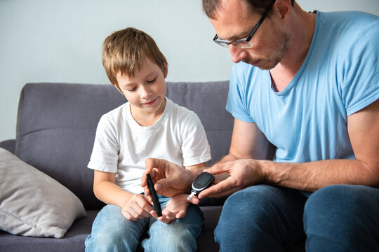 Concept Children Diabetes Children With Glucometer Learning To Check Blood Sugar Level At Home. Learn To Use A Glucometer. Education Of Diabetic Kids