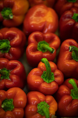 Red pepper with green pod. Healthy vegetables on market. Delicious food.