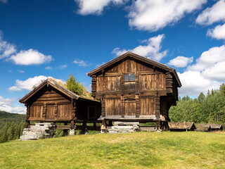 Beautiful historical farmhouses and granaries dotting the countryside of the Telemark region in Norway. Rauland, Telemark, Norway