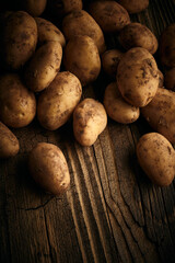 Potatoes over wooden vintage backdrop