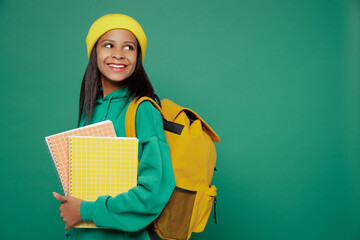 Little kid teen girl of African American ethnicity 13-14 years old wear casual hoody hat backpack...