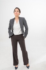 Studio portrait photo of a young beautiful elegant Brazilian female businesswoman lady wearing smart casual business attire suit posing with a series moments of emotion and gesture for all application