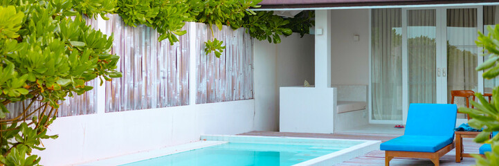 view on villa with pool at sunrise in the Maldives, the concept of luxury travel