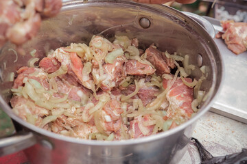 the pickled shish kebab is in a saucepan