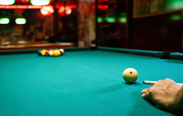 Preparing to break spheres into the pool pocket. People billiard, snooker entertainment concept.