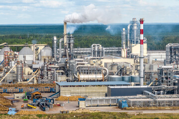 Obraz premium aerial panoramic view on pipes of chemical enterprise plant. Air pollution concept. Industrial landscape environmental pollution waste of thermal power plant