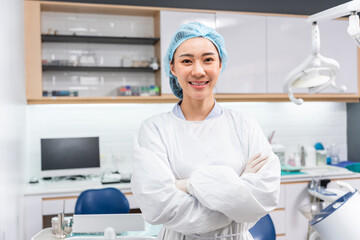 Portrait of Asian beautiful dentist standing at dental health clinic