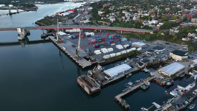 Casco Bay Bridge and shipping port in Portland Maine. Aerial view of logistics center on water.